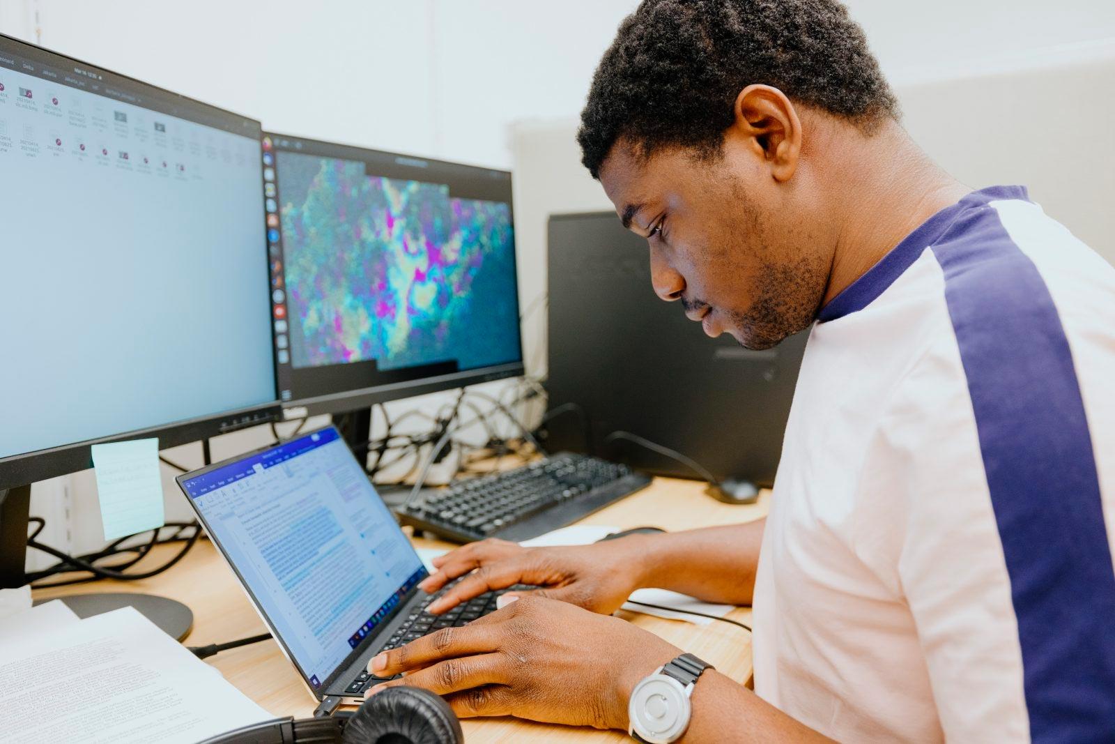 Black professional man reviewing digital work